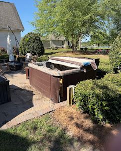 Old hot tub on a back deck before removal