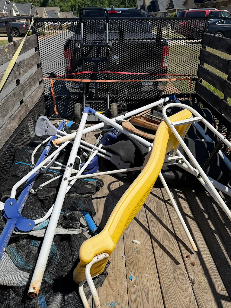 Mixed debris loaded onto a trailer for hauling in Byron, GA